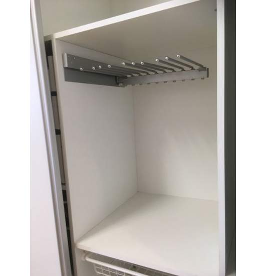 Trouser rack with metal rails fixed inside a white wardrobe section.